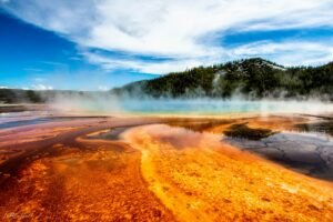 geyser within mountain range during daytime