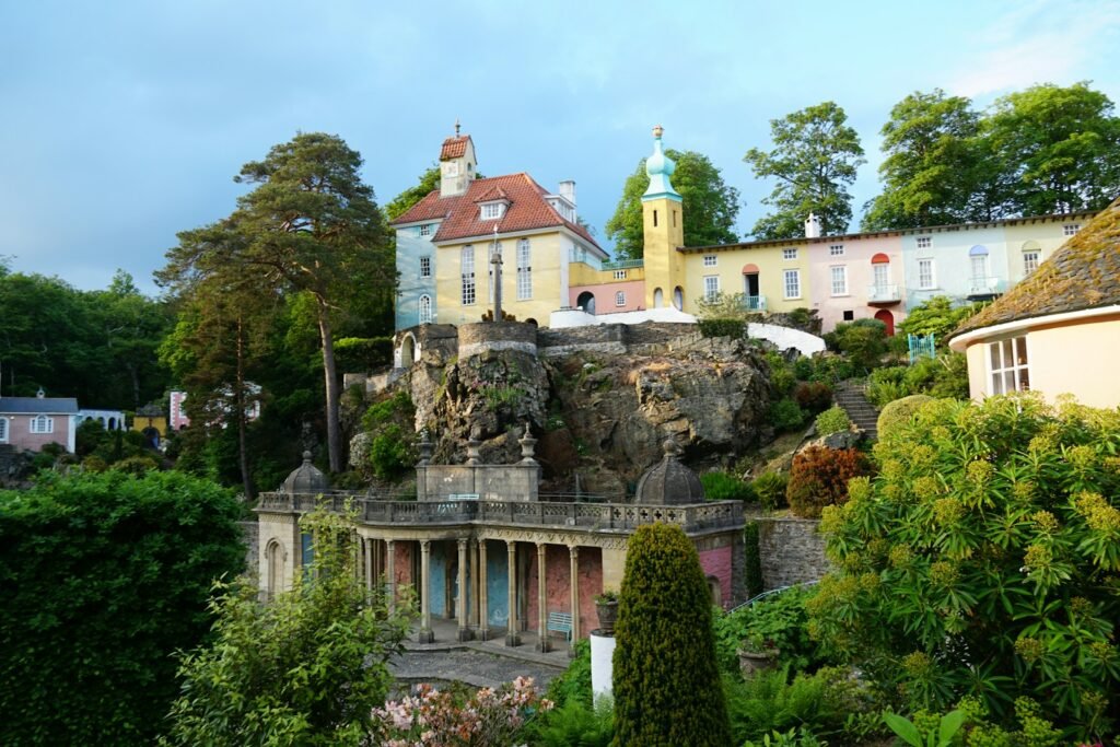 A house on a hill surrounded by trees and bushes